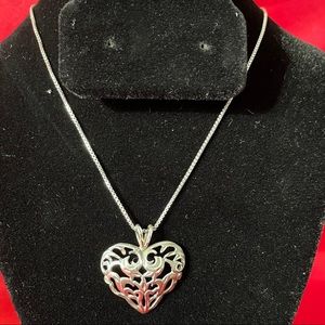 Sterling silver heart necklace with 24” chain.